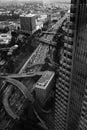 Panoramic greyscale cityscape view with high buildings and crossed roads Royalty Free Stock Photo
