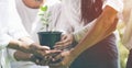 Panoramic group of volunteers hands planting tree seedling in park. World environment day and sustainable resource concept Royalty Free Stock Photo