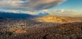 Panoramic HDR photo of the city of La Paz, Bolivia, during sunset with Illimani Mountain rising in the background