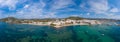 Panoramic high resolution wide aerial photo of the beach front in Ibiza in Spain, showing the coastal Spanish beaches and the Royalty Free Stock Photo