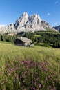 Panoramic image of Italian Dolomites with famous peaks and chalets, South Tyrol, Italy, Europe at summer sunset. Awesome