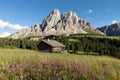 Panoramic image of Italian Dolomites with famous peaks and chalets, South Tyrol, Italy, Europe at summer sunset. Awesome