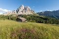 Panoramic image of Italian Dolomites with famous peaks and chalets, South Tyrol, Italy, Europe at summer sunset. Awesome