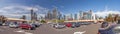 Panoramic image of Melbourne skyline taken from busy parking lot in front of shopping mall