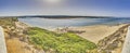 Panoramic image of the mouth of the river Rio Mira into the Atlantic Ocean