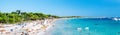 Panoramic image people swimming and sunbathing on the picturesque Las Salinas beach