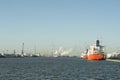 Panoramic image of petrochemicals in the port of Antwerp with moored ships and steam coming out of the chimneys