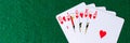 Panorama. Royal flush of hearts on green background. Winning hands of poker playing cards