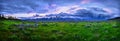 Panoramic image of a thunderstorm over the Grand Teton mountain range