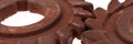 Panoramic image. Two incredible rusty chocolate gears Royalty Free Stock Photo