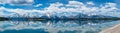 Panoramic of the Jackson Lake reflection of the Teton Mountain range at the turnoff just north of the Chapel of the Sacred Heart
