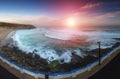 Panoramic landscape of amazing sunrise on the ocean. View of dramatic cloudy sky and stony coast. Portugal. Concept of harmony wit Royalty Free Stock Photo