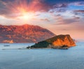 Panoramic landscape of coast Budva riviera:Sveti Nikola island and mountains at sunset. Royalty Free Stock Photo