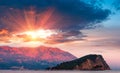 Panoramic landscape of coast Budva riviera:Sveti Nikola island and mountains at sunset. Royalty Free Stock Photo