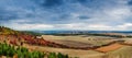 Panoramic landscape of farmland in autumn with colorful trees and dramatic sky, top view Royalty Free Stock Photo