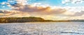 Panoramic landscape with lake shore of colorful sunset  in spring Royalty Free Stock Photo