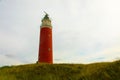 Panoramic landscape with the lighthouse of Cocksdorp with grass dunes in the forground, Nationalpark Duinen van Texel, Texel islan Royalty Free Stock Photo