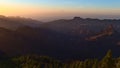 Panoramic landscape with majestic sunset above the rugged mountains of Gran Canaria, Canary Islands, Spain. Royalty Free Stock Photo