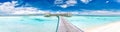 Panorama of Water Villas Bungalows and wooden bridge at Tropical beach in the Maldives at summer day Royalty Free Stock Photo