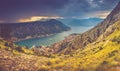 Panoramic landscape of mountain ridge with path descends down and Kotor bay at distance. Royalty Free Stock Photo