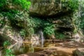 Panoramic landscape of mountain with waterfall and river in the tropical rainforest in Gunung Mulu National park. Royalty Free Stock Photo