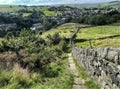 Rural landscape on, Height Lane, with old steps, fields and houses in, Oxenhope, Yorkshire, UK