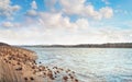 Panoramic landscape with lake shore and cloudy sky  in spring Royalty Free Stock Photo