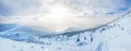 Panoramic landscape of a snowy forest in the mountains on a sunny winter day whis. Ukrainian Carpathians, near Mount Petros, there