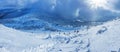 Panoramic landscape of a snowy forest in the mountains on a sunny winter day whis. Ukrainian Carpathians, near Mount Petros, there