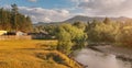 Landscape of taiga forest and a low mountain or hill. Small farm house near wild clean river Royalty Free Stock Photo