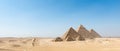 Panoramic View of Three Great Pyramids of Giza in Desert Royalty Free Stock Photo