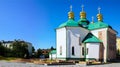 Landscape view of ancient Church of the Saviour at Berestovo. A portion of the wall cleaned from stucco belongs to the 12th cen.