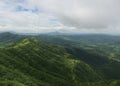 Panoramic landscape view of beautiful lush green Sahyadri mountains in monsoon season as seen from Sinhgad fort located in Pune, Royalty Free Stock Photo