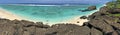 Panoramic landscape view of Black Rock Beach in Rarotonga Cook I Royalty Free Stock Photo