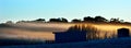 Panoramic landscape view of a cold frosty winter morning
