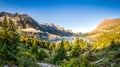 Panoramic landscape view of Glacier NP mountain range and lake Royalty Free Stock Photo