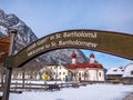 Panoramic landscape view of scenic mountain scenery with Church Saint Bartholomew winter snow season