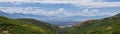 Panoramic Landscape view from Travers Mountain of Provo, Utah County, Utah Lake and Wasatch Front Rocky Mountains, and Cloudscape.