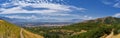 Panoramic Landscape view from Travers Mountain of Provo, Utah County, Utah Lake and Wasatch Front Rocky Mountains, and Cloudscape. Royalty Free Stock Photo