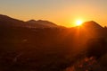 Panoramic landscape view of vineyard,green hills and country road in Crete, Greece. Sunset light.