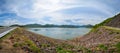 Panoramic Landscape view of water reservoir or dam with many tree and mountain all aroun Royalty Free Stock Photo