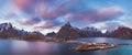 Panoramic landscape, winter mountains and fjord reflection in water. Norway, the Lofoten Islands.