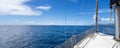 Panoramic of the larboard of a sailboat in the mediterranean sea.