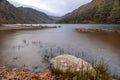 Panoramic long exposure view, silky water during autumn in the Wicklow Mountains. Rock on front,