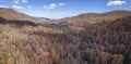 Panoramic low aerial view of autumn colors in the Blue Ridge Mountains of North Carolina, USA Royalty Free Stock Photo