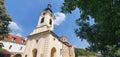 Panoramic low-angle shot of the Mesic Monastery in Serbia against a blue cloudy sky Royalty Free Stock Photo