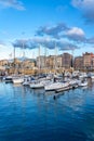 Panoramic marina with many small sailing boats docked on the shore of the city of Gijon, Asturias, Spain. Royalty Free Stock Photo