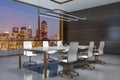 Panoramic meeting room interior with furniture and night city view.