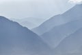 Panoramic misty view of angel rays from Sunrise and the Wasatch Front Rocky Mountain range looking East in Salt Lake City Utah in