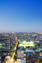 Panoramic modern city skyline bird eye aerial night view under dramatic neon glow and beautiful dark blue sky in Tokyo, Japan Royalty Free Stock Photo